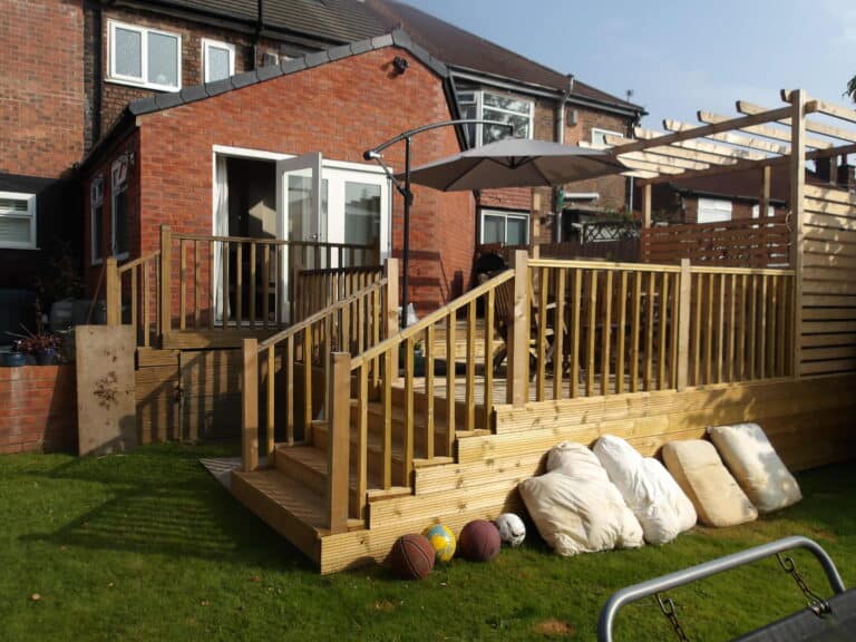 Decking installation and potential damp issues in garden areas.